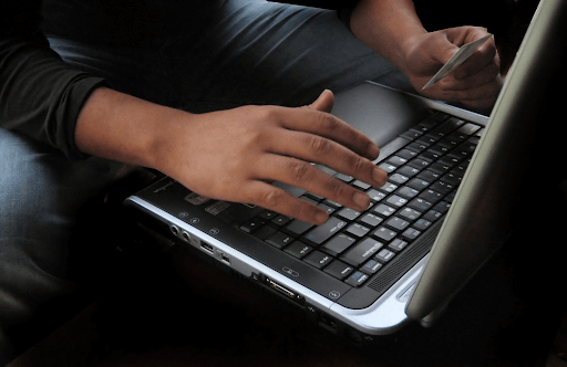 Person typing on laptop
